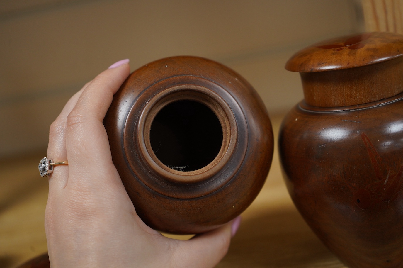 A pair of 18th century lacquered pear wood tea caddies, as seen in Pinto's book, page 293 and plate 315 (D), 12.5cm tall. Condition - repairs to covers, some wear to lacquer